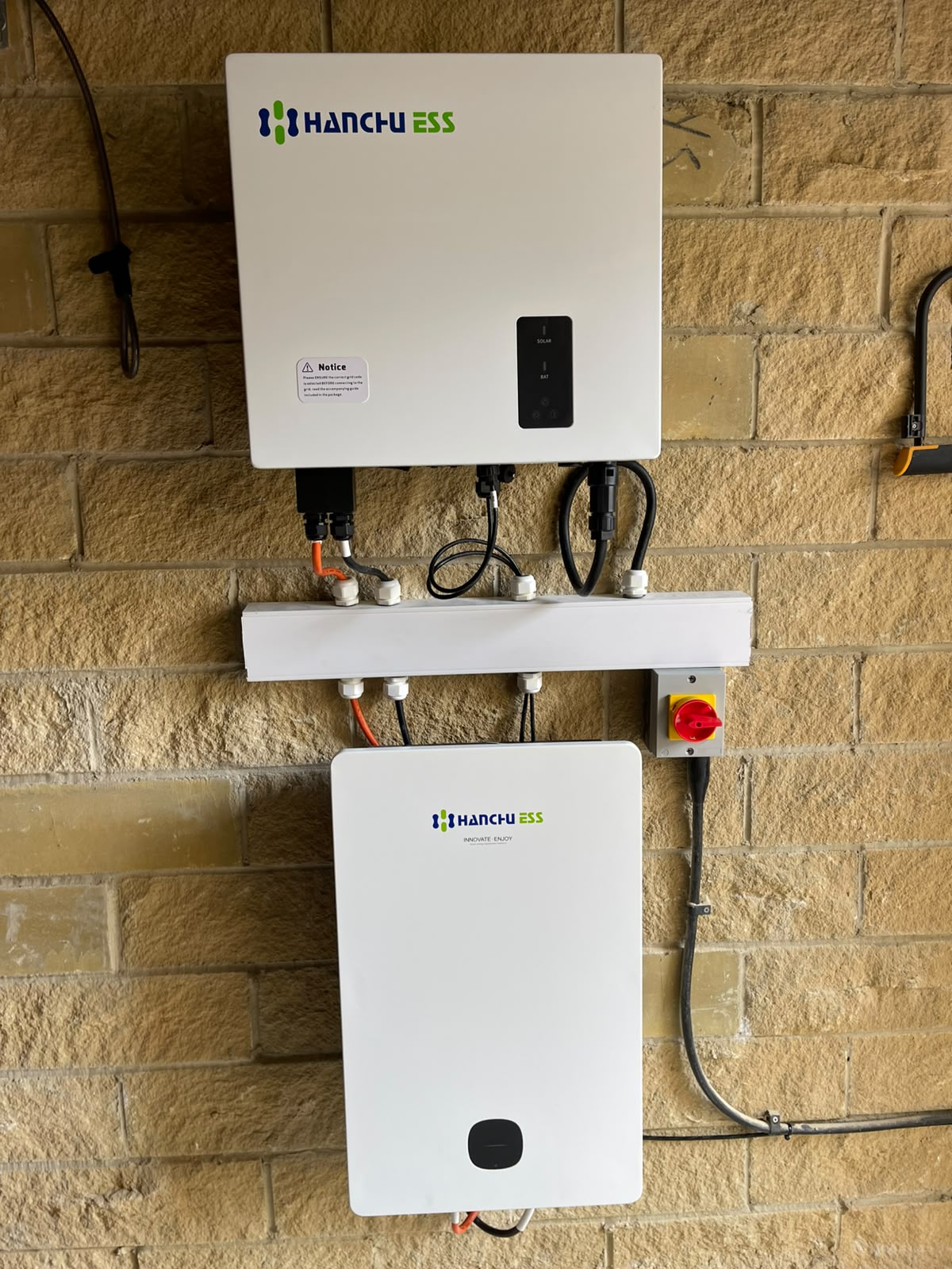 Completed Hanchu ESS inverter and battery installation on the garage wall