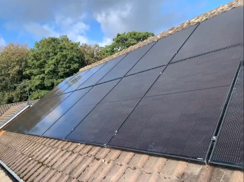 All-black solar panel array on a tiled roof