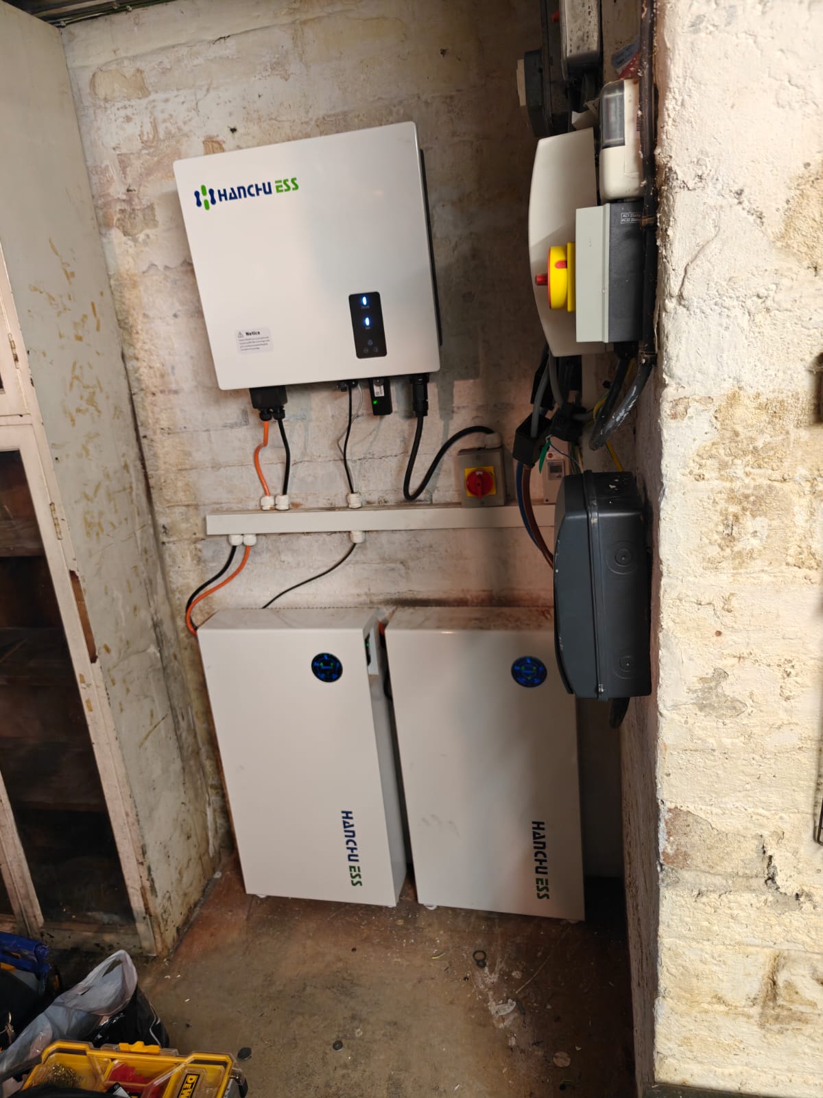 Hanchu ESS inverter and batteries installed in a garage